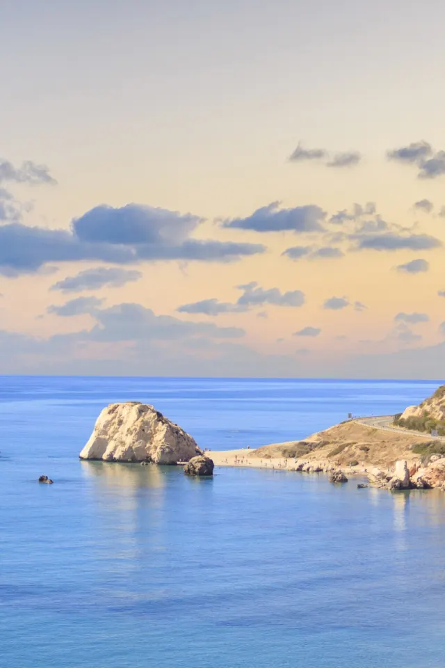 Golden-hour panorama over the bay of Aphrodite's Rock, Petra tou Romiou