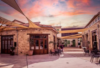Traditional stone courtyard in Paphos Old Town at sunset