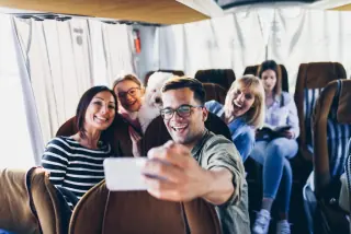 Happy travelers on board a Project Cyprus Tours excursion bus