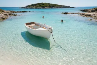 White boat in a turquoise lagoon